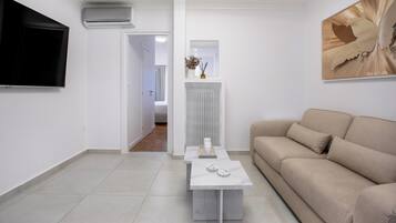 Classic Apartment, Balcony, City View | Living room | 55-inch Smart TV with digital channels