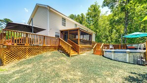 A two-story house with a deck, a swimming pool, and a covered outdoor seating area. - 4 Mi to Fsu: Family Home w/ Pool & Yard 75-inch TV (Tallahassee)