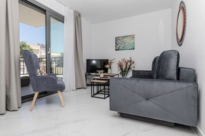Departamento de lujo, vista a la ciudad | Área de sala de estar