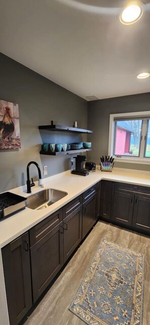 Fridge, microwave, stovetop, coffee/tea maker
