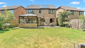 Relax in the spacious backyard with a patio area, perfect for unwinding or hosting guests.