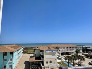Enjoy ocean views from the upper-floor balconies of this beachfront hotel.