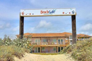 A beachfront building with a sign reading "BeachGate CondoSuites & Hotel". - Beachgate Condo Suites And Hotel 341 2 Bedroom Condo (Port Aransas)
