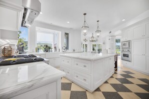 Fridge, microwave, oven, stovetop - Villa Clarinda- Architect-Designed Dream Estate with Theater, & Outdoor Oasis (Tarzana)