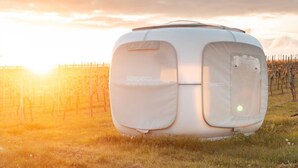 A white RV parked in a field with a vineyard in the background. - Romantik zwischen Weinreben - Cube (Roemerberg)