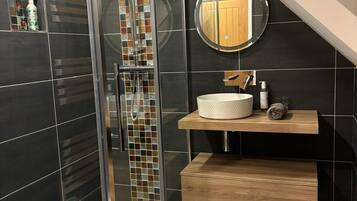 Shower, hair dryer, towels, soap