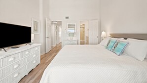 A bedroom with a bed, a television, a dresser, and a ceiling fan. - NEW LISTING!!! Gulfside Villa 2B-  AMAZING beachfront view  NO HASSLE CHECK OUT (Perdido Key)