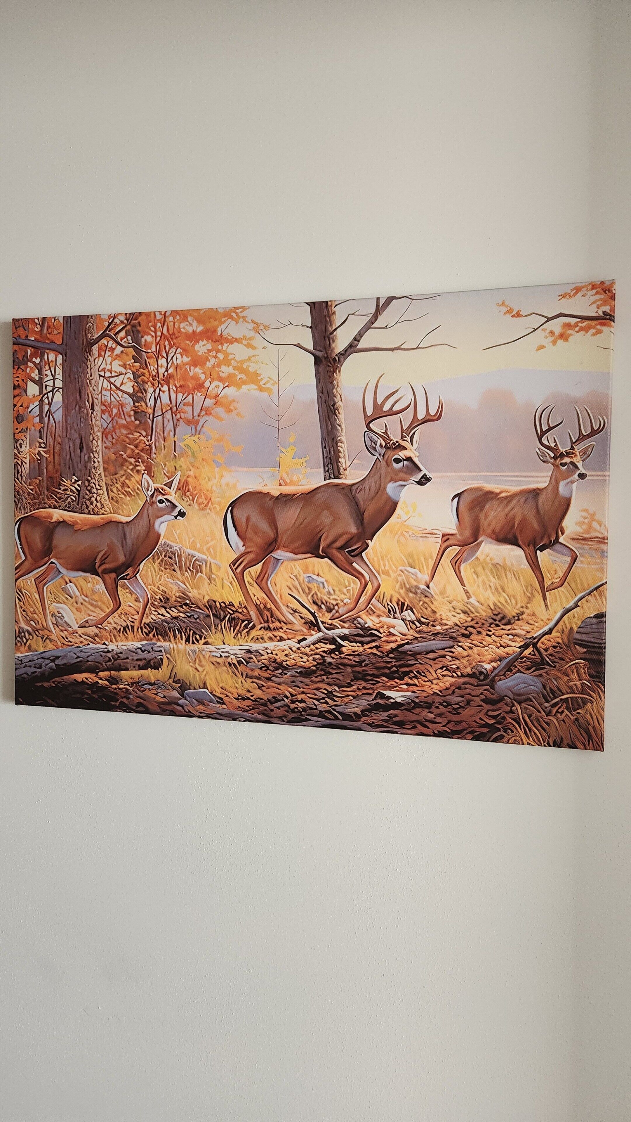 A painting of three deer in a forest setting.