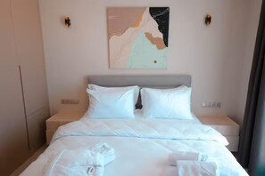 Premium bedding, down duvets, desk, laptop workspace