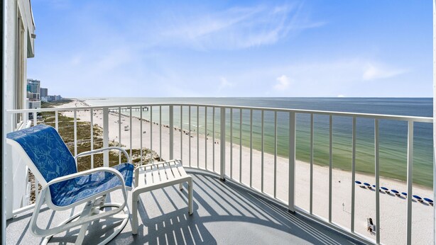 A balcony with a view of a beach and ocean. - Summerchase Penthouse 1 (Orange Beach)
