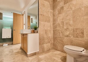 A modern bathroom with a large mirror, a sink, and a toilet. - Pool & Beachfront Stay at Nuevo Vallarta (Bucerías)
