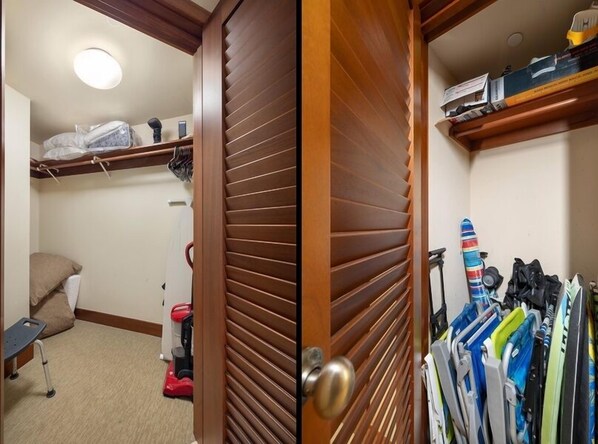 A compact storage room with shelves, a vacuum cleaner, and a wheelchair.