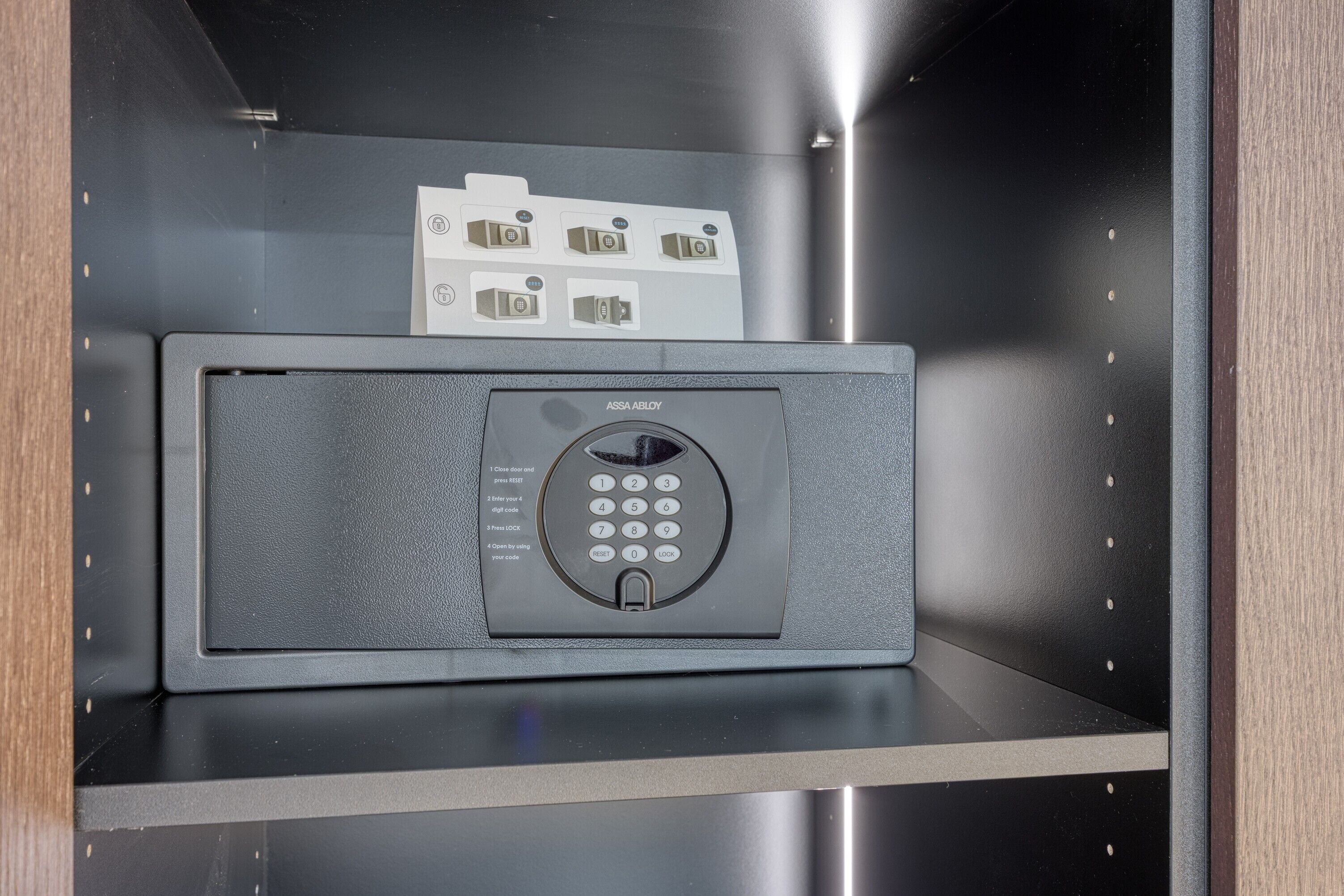 A secure storage unit with a keypad lock and a card slot.