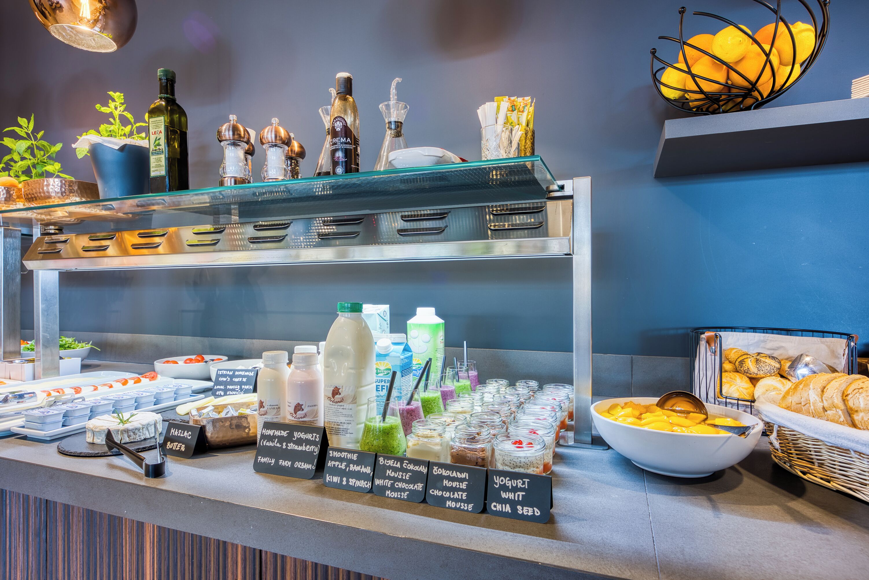 A breakfast buffet with various food items and beverages.