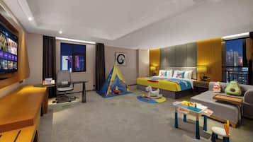 A modern hotel room with a bed, a desk, a TV, a window with curtains, and a city view.