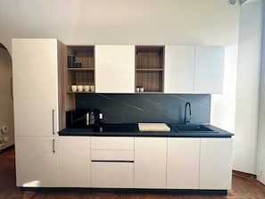 Fridge, microwave, stovetop, coffee/tea maker