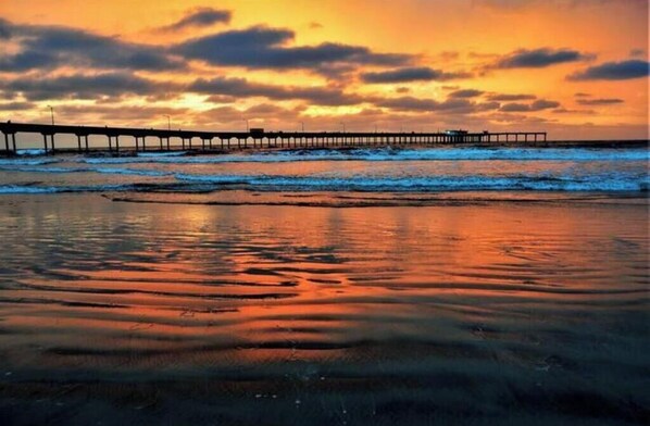 Stroll along the serene beach and enjoy the tranquil atmosphere of the ocean.