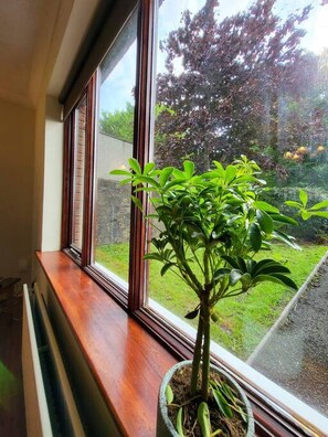 Enjoy a serene view of the garden from this cozy window perch.