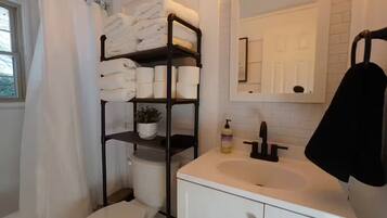 Hair dryer, towels, soap, toilet paper