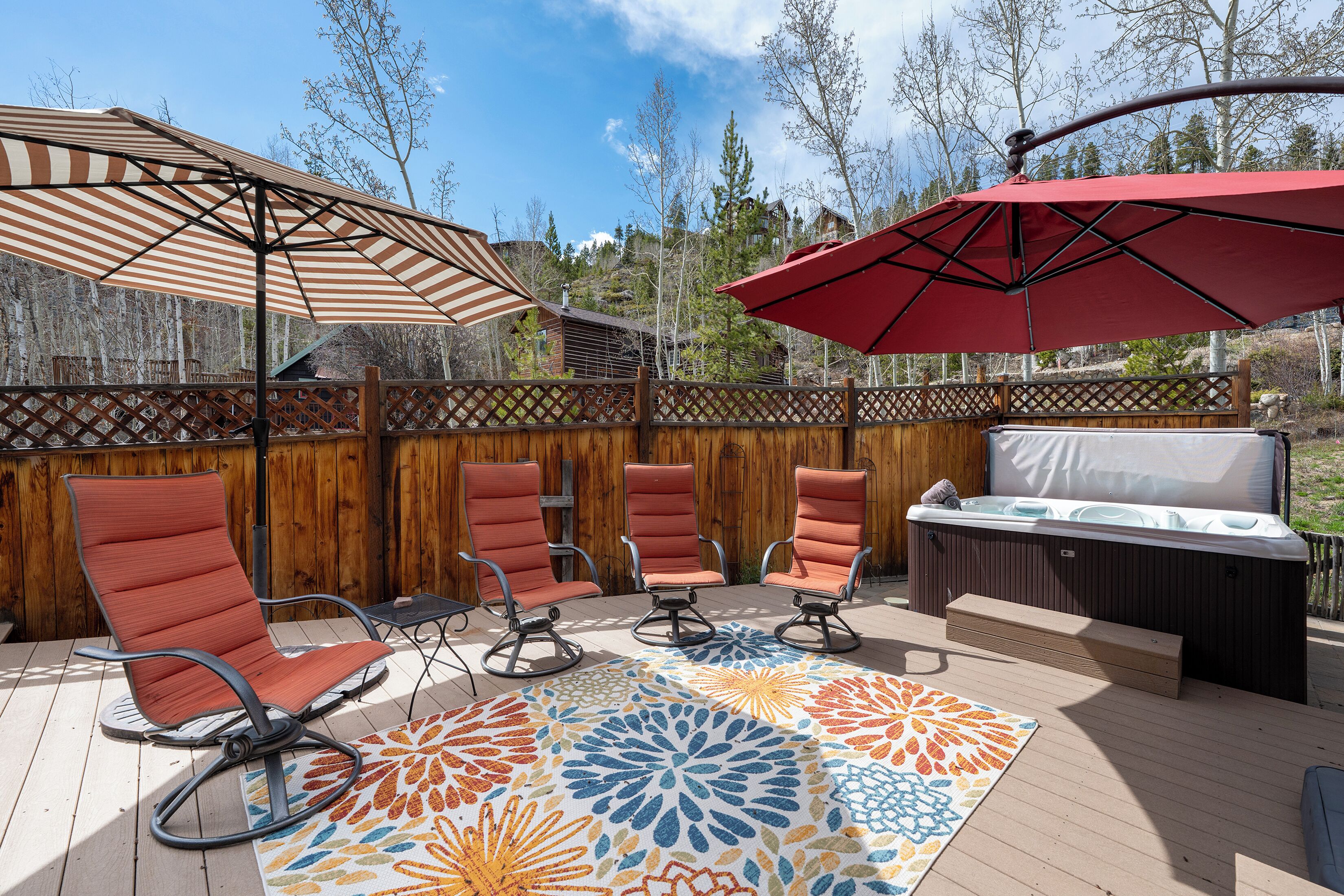 Spacious outdoor patio with private hot tub, gas grill, fire pit and plenty of seating!