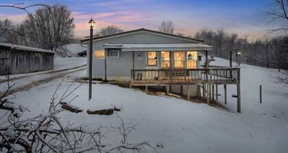 8700 Wood Rd, Chesterhill, OH - Property with a small cabin and a single family home