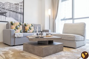 Luxury Apartment, City View | Living area | 60-inch Smart TV with cable channels