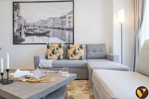 Luxury Apartment, City View | Living area | 60-inch Smart TV with cable channels - Brand New with Relaxing Pool & Kids Area (Dubai)