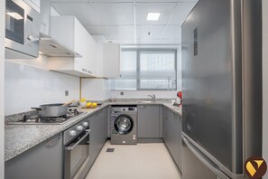 Luxury Apartment, City View | Private kitchen | Full-sized fridge, microwave, oven, stovetop