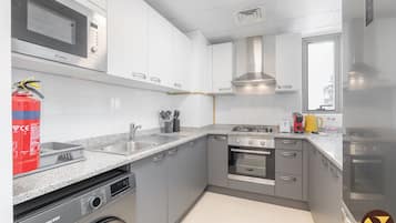 Luxury Apartment, Balcony, City View | Private kitchen | Microwave, oven, stovetop, toaster