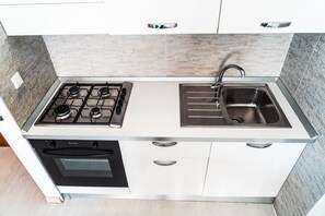 Fridge, highchair, cookware/dishes/utensils