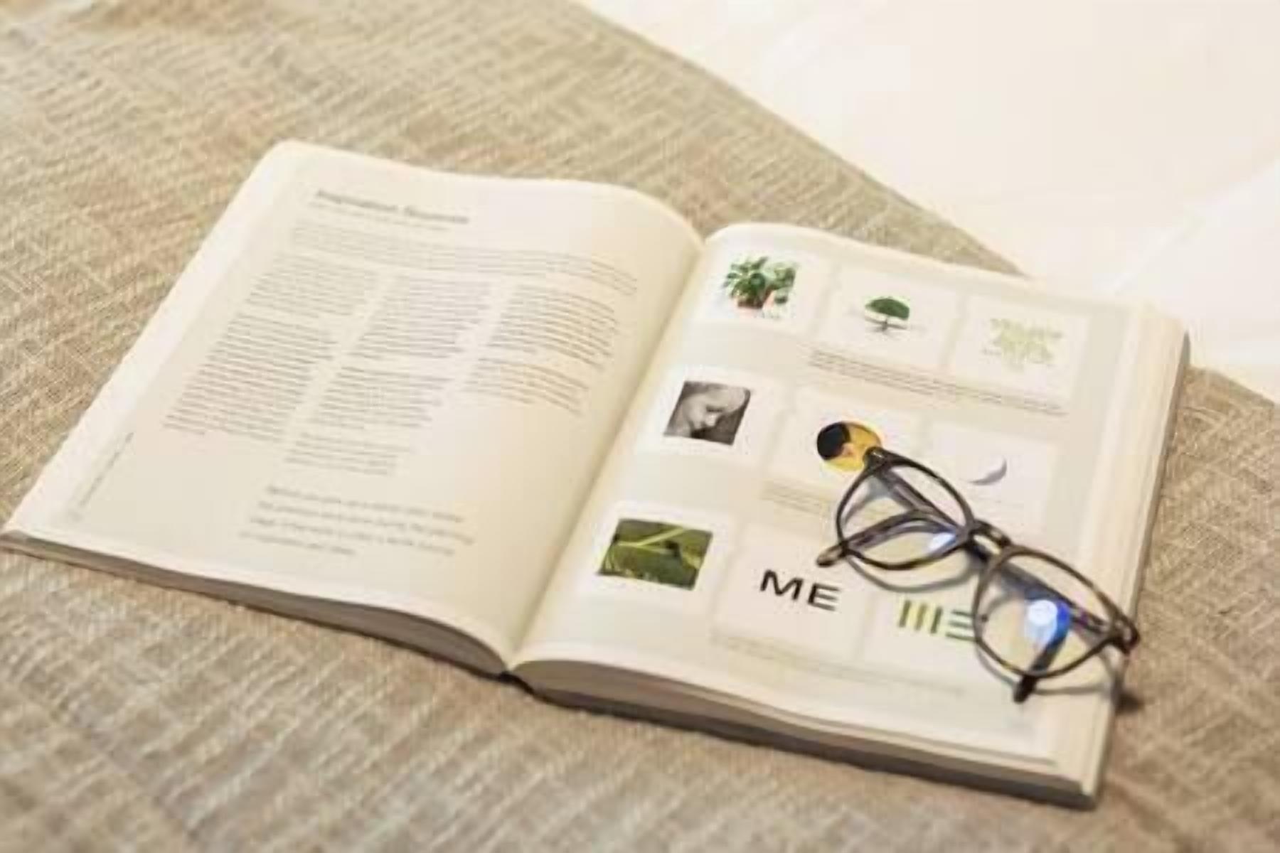An open book with text and images on a textured surface.