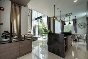 Villa, 2 Bedrooms, Patio | Living area | 55-inch LED TV with digital channels