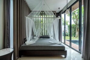 A modern bedroom with a canopy bed, large windows, and a view of the outdoors. - Panora Villa 8112 By Villacarte (Choeng Thale)