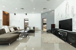 Family Villa | Living area | 65-inch LED TV with digital channels