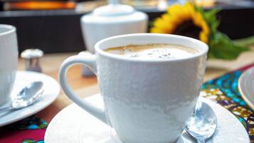 A white ceramic mug with a textured surface, placed on a white saucer with a spoon beside it.