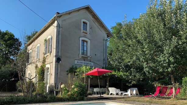 A building labeled "BLOND-BERNEUIL" with a swimming pool and outdoor seating. - Former French railway station with private swimming pool and WIFI (Blond)