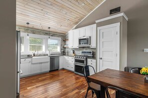 Fridge, microwave, coffee/tea maker, cookware/dishes/utensils