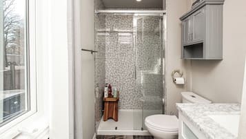 Shower, towels, soap, toilet paper