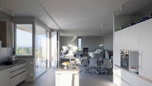 A modern kitchen with a central island, large windows, and a dining area with chairs and a table. - Villa Itaca - Three Bedroom Villa, Sleeps 5 (Casorzo)