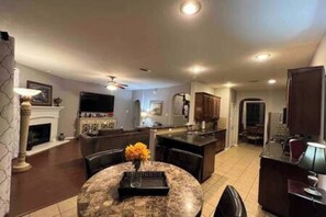 TV, fireplace, books