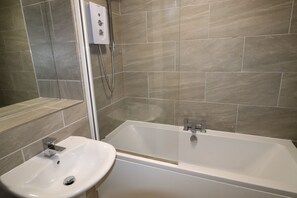 Shower, towels, soap, toilet paper