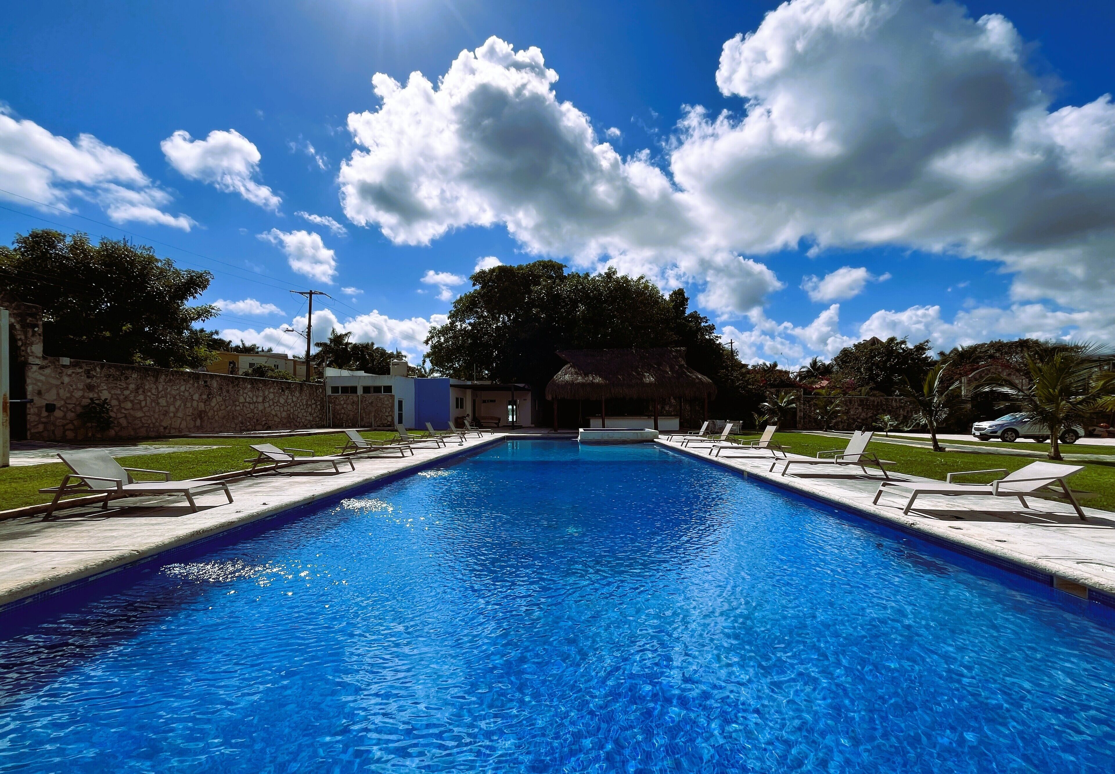 Outdoor pool, open 8:00 AM to 9:00 PM, pool loungers
