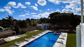 Outdoor pool, open 8:00 AM to 9:00 PM, pool loungers