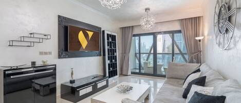 Luxury Apartment, City View | Living area | 55-inch Smart TV with satellite channels