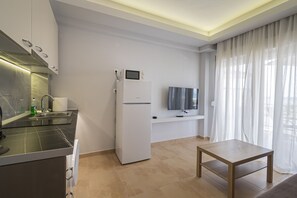 Fridge, coffee/tea maker, toaster, cookware/dishes/utensils