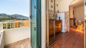 A kitchen with wooden cabinets and a white refrigerator.