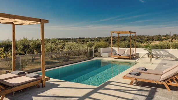 A rooftop pool with wooden loungers and a wooden pergola, surrounded by a clear view of the countryside. - Panagis Villa - Three Bedroom Villa, Sleeps 6 (Karavados)