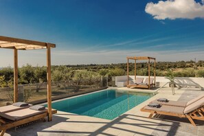 A rooftop pool with wooden loungers and a wooden pergola, surrounded by a clear view of the countryside. - Panagis Villa - Three Bedroom Villa, Sleeps 6 (Karavados)