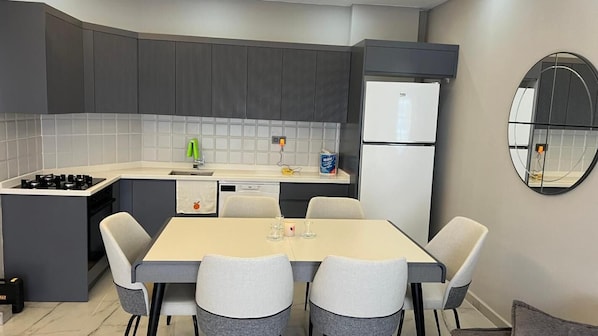 Fridge, oven, dishwasher, cookware/dishes/utensils
