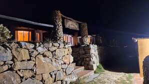 A stone-walled building with a sign reading "Refugio Eco Kolubiel". - Kalluchi Ecolodge SunIsland TiticacaLake (Isla del Sol)